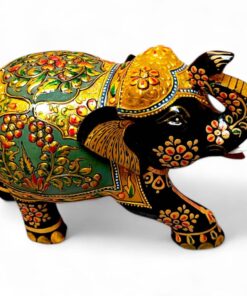 Ornate hand-painted Indian elephant figurine with raised trunk and gold floral decorations.