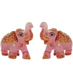 Pink decorative elephant figurines with ornate Indian-style painted details.