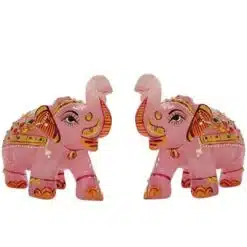 Pink decorative elephant figurines with ornate Indian-style painted details.