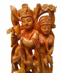 Wooden Radha Krishna flute sculpture with ornate Hindu devotional carving.