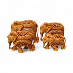 Handcrafted wooden elephant figurine family with intricate Indian carved decor.