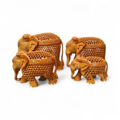 Handcrafted wooden elephant figurine family with intricate Indian carved decor.