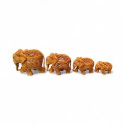 Hand-carved wooden elephant figurine set with decorative lattice design.