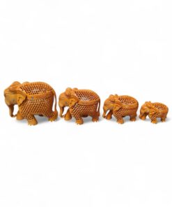 Hand-carved wooden elephant figurine set with decorative lattice design.