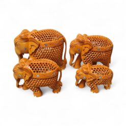 Handcrafted carved wooden elephant figurine set with ornate lattice designs.