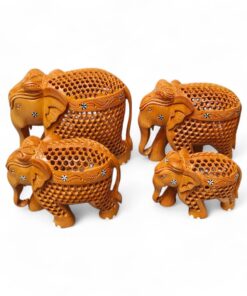 Handcrafted carved wooden elephant figurine set with ornate lattice designs.