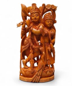 Hand-carved wooden Radha Krishna statue with flute, lotus pedestal, and peacock details.
