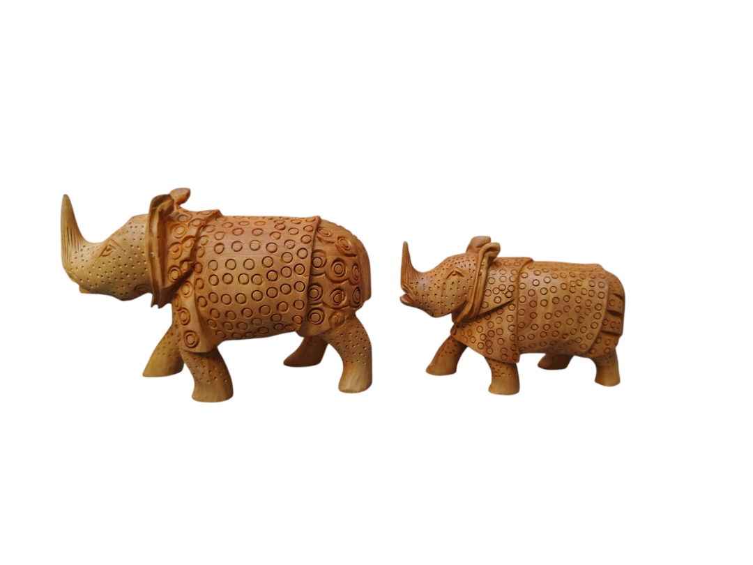 Handcrafted wooden rhinoceros figurines, carved brown rhino sculptures with tribal patterns.