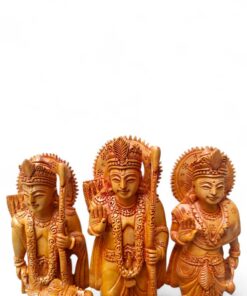Carved wooden Hindu Rama, Sita, and Lakshman devotional statues.