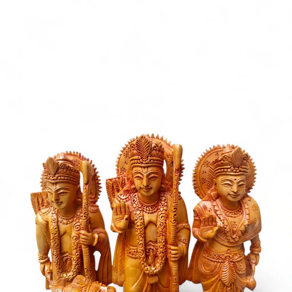Carved wooden Hindu Rama, Sita, and Lakshman devotional statues.