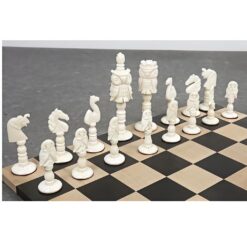 Camel bone chess pieces on modern wooden chessboard.
