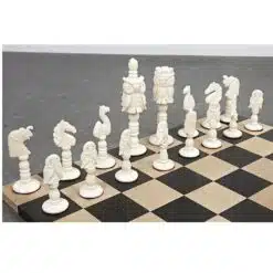 Camel bone chess pieces on modern wooden chessboard.