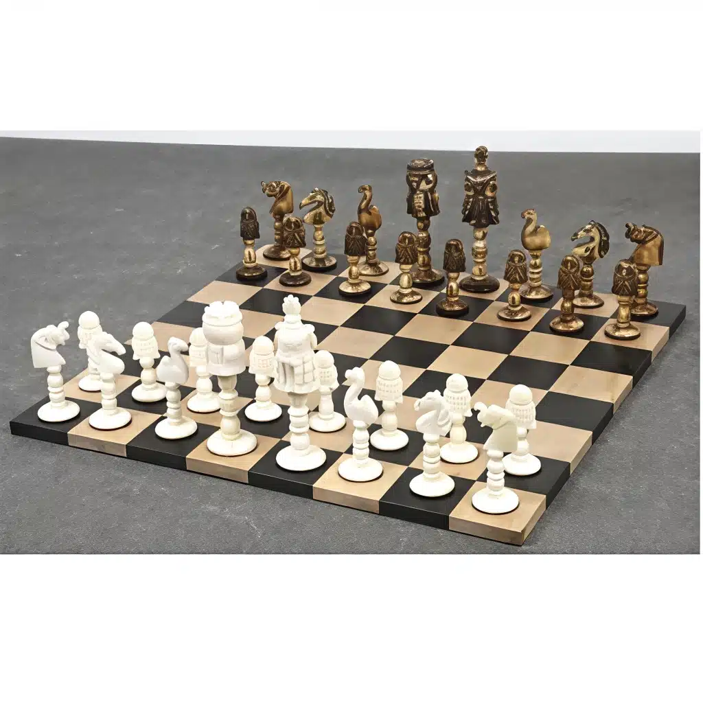 Luxury fantasy chess set with ornate camel bone and bronze pieces on wooden board.