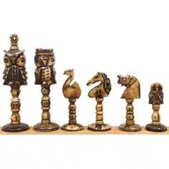 Hand-carved bone animal chess pieces with owl, horse, and bird designs.