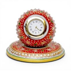 Traditional Indian hand-painted red marble table clock with gold accents and gemstones.
